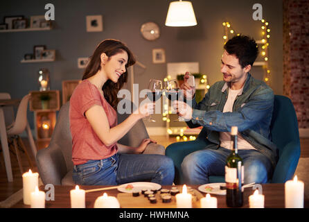 Young couple having toast for lovely evening Stock Photo
