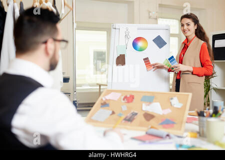 Fashion designers choosing trendy colors for new seasonal collection Stock Photo