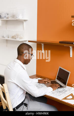Confident engineer browsing in the net in his office Stock Photo