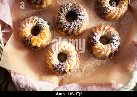 Mini marble bundt cakes with powder sugar Stock Photo