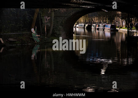 Regents canal the bridge to primrose hill via tow path with Amy Winehouse graffiti Stock Photo