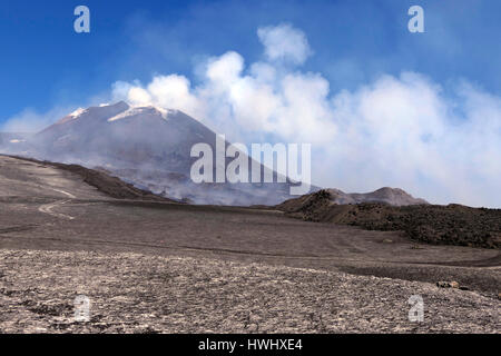 View of crater summit, snow, lava, smoke, magma and molten rocks. March 2017 eruption on Mount Etna in Sicily, southern Italy, the largest active volc Stock Photo