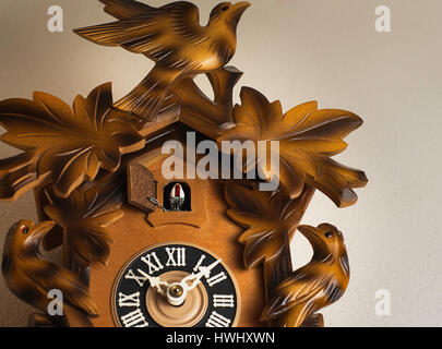 A cuckoo clock on a wall. Stock Photo