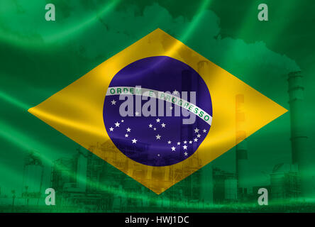 3D rendering of Brazil's flag on silky satin and double exposure of factory smoke stacks in the background, signifying the serious industry pollution  Stock Photo