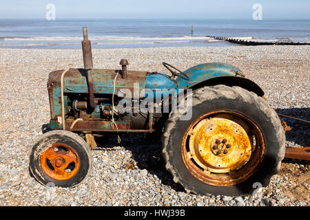 A tractor on Cromer beach in Norfolk England UK Stock Photo