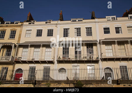 Facades of houses on Royal York Cresent in the Clifton district of Bristol, England. Houses on the Georgian terrace have wrought iron balconies. Stock Photo