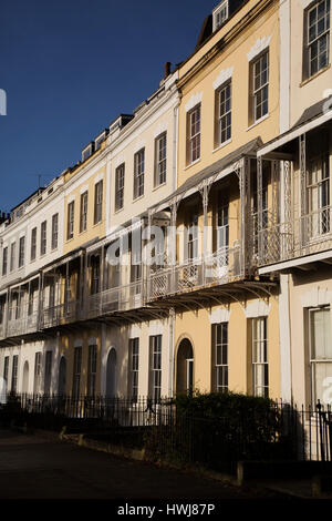 Facades of houses on Royal York Cresent in the Clifton district of Bristol, England. Houses on the Georgian terrace have wrought iron balconies. Stock Photo