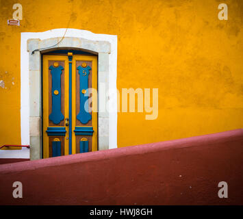 Blue and Yellow Door in Guanajuato, Mexico ------ Guanajuato is a city and municipality in central Mexico and the capital of the state of the same nam Stock Photo