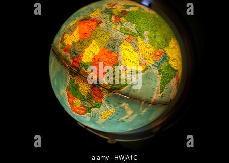 close up of old fashioned world globe a ball shaped map lit from within focusing on South Africa and antartic Stock Photo