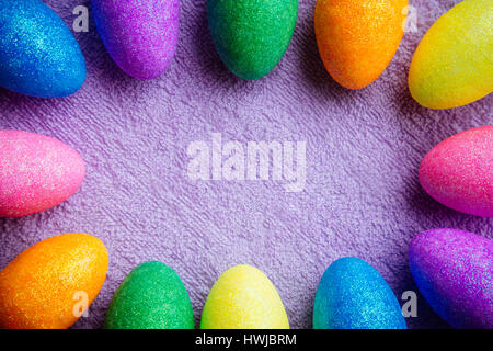 Colorful Easter Eggs on a fabric background. Creative concept Stock Photo