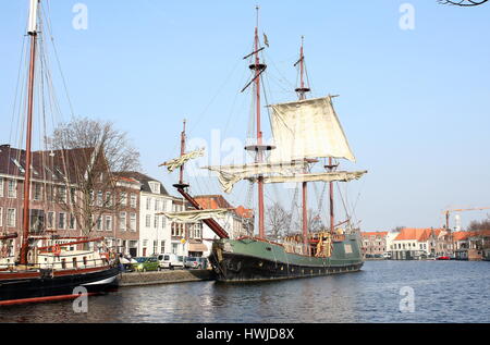 Historic replica sailing ship Soeverein (2005, loosely based on an East Indiaman VOC ship) moored along Spaarne river in central Haarlem, Netherlands Stock Photo