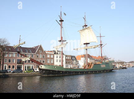 Historic replica sailing ship Soeverein (2005, loosely based on an East Indiaman VOC ship) moored along Spaarne river in central Haarlem, Netherlands Stock Photo