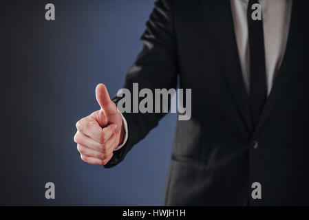 A man passing by using biometric fingerprint reader Stock Photo