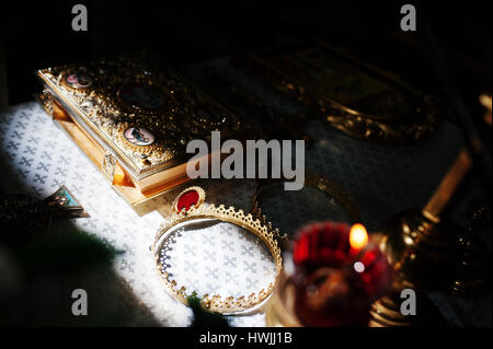 Sun shining at Bible Gospel and crowns at church on wedding ceremony. Faith religion concept. Stock Photo