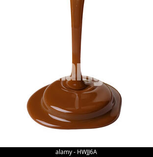Melted chocolate syrup flows down. Isolated on white background. Stock Photo