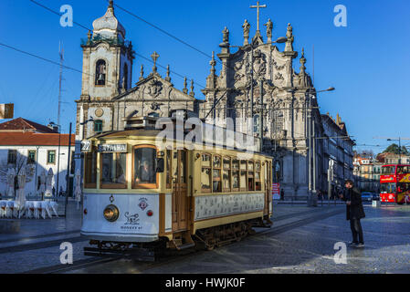 Vintage tram in front of Carmelite Church (Igreja dos Carmelitas Descalcos) and Carmo Church (Igreja do Carmo) in Vitoria parish of Porto, Portugal Stock Photo