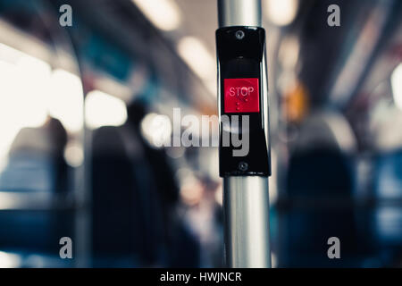 Image of a "STOP" button on a bus. Stock Photo