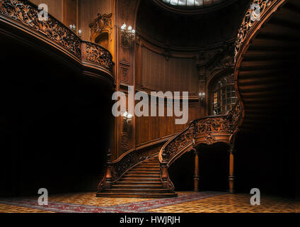 House of Scientists. Interior of the magnificent mansion with ornate grand wooden staircase in the great hall. A former national casino. Stock Photo