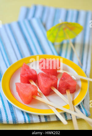 Piece of watermelon hearts shapes on plate Stock Photo