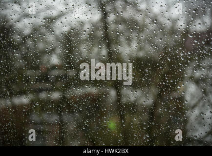 Raindrops on a window seen closeup Stock Photo