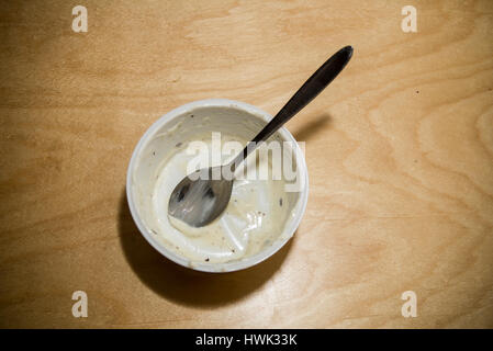 Empty yoghurt bowl  on a table Stock Photo
