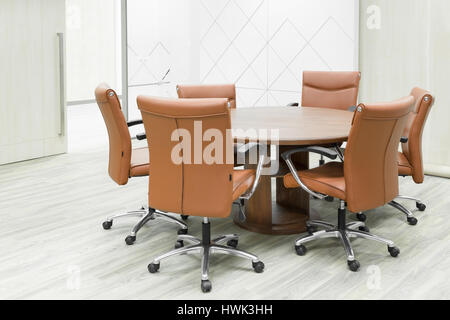 Meeting wooden table and brown chairs in meeting room i Stock Photo