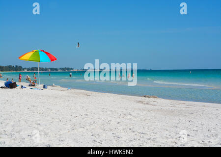 White sands of the Gulf of Mexico, Florida Swimmers in photo, No Model Release. Stock Photo