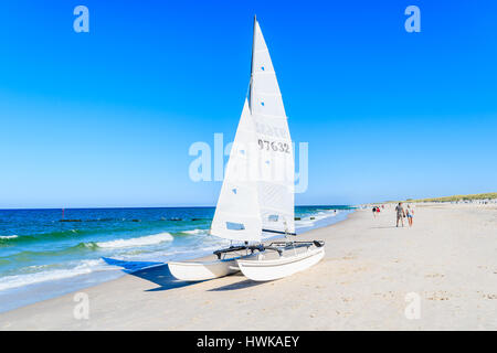 SYLT ISLAND, GERMANY - SEP 9, 2016: Sailing boat on Kampen beach, Sylt island, Germany. Stock Photo