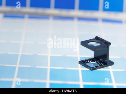Printing loupe on proof CMYK color chart Stock Photo - Alamy