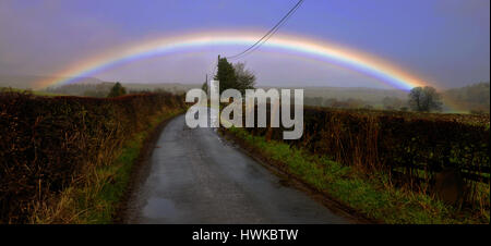 A perfect rainbow after the rain clears in North Yorkshire Dales in Swinithwaite Stock Photo