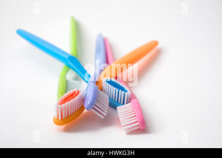 colorful toothbrushes on white background Stock Photo