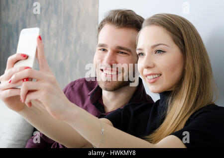 Young couple taking a selfie photo. selfie young couple technology taking photo happy love concept Stock Photo