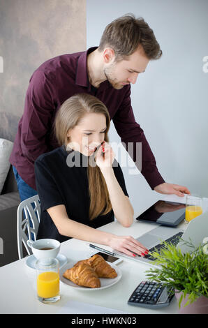 Couple working with laptop in home. homeworking business office concept Stock Photo