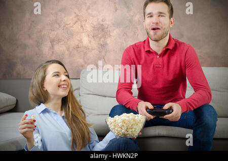 Couple enjoys free time and playing video games. couple play video game watching home fun watch concept Stock Photo