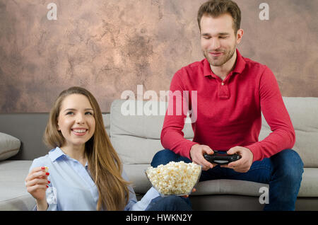 Couple enjoys free time and playing video games. couple play video game watching home fun watch concept Stock Photo