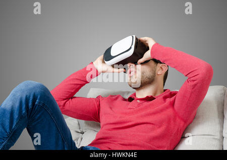 Man wears virtual reality glasses with smartphone inside. vr glasses virtual reality glass 3d cyberspace simulation concept Stock Photo