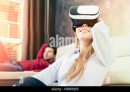 Woman using VR virtual reality glasses. video vr virtual reality games female playing headset concept Stock Photo