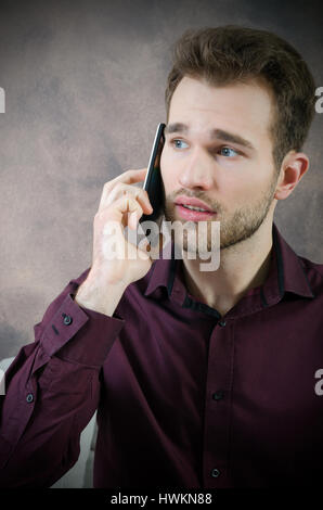 Handsome man talking on the phone. phone man talking call mobile calling business young concept Stock Photo