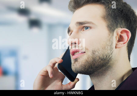 Handsome man talking on the phone. man talking call mobile calling business young concept Stock Photo