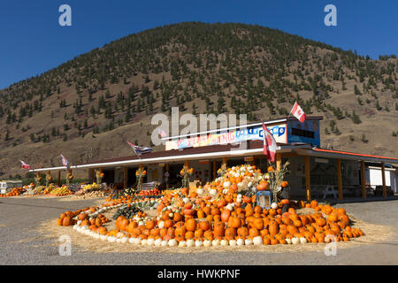 Keremeos, British Columbia, Canada - September 30, 2016: An arrangement of winter squash at The Peach King Fruit Stand located in Keremeos, British Co Stock Photo