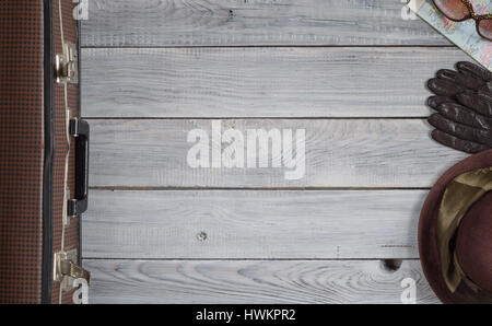 Female hat and retro accessories for travel on a white painted wooden surface Stock Photo