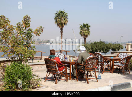 Relaxing by the River Nile at Luxor looking across to the West Bank Stock Photo