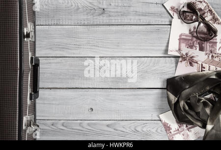 Female hat and retro accessories for travel on a white painted wooden surface Stock Photo