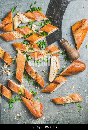 Close-up of Turkish pide cut in slices and kitchen chopper Stock Photo