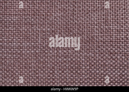 Light brown background with braided checkered pattern, closeup. Texture of the weaving fabric, macro. Stock Photo
