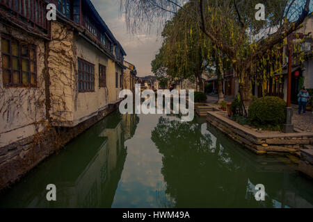 SHANGHAI, CHINA: Famous Zhouzhuang water town, ancient city district with channels and old buildings, charming popular tourist area Stock Photo