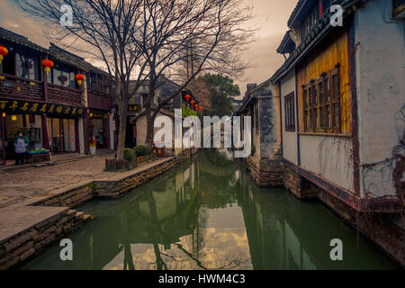 SHANGHAI, CHINA: Famous Zhouzhuang water town, ancient city district with channels and old buildings, charming popular tourist area Stock Photo