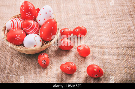 Colorful Easter eggs decoration on a burlap Stock Photo