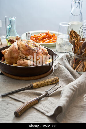 Roast chicken dinner on a table. Stock Photo