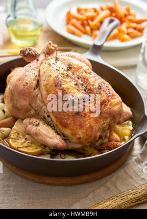 Roast chicken dinner on a table. Stock Photo